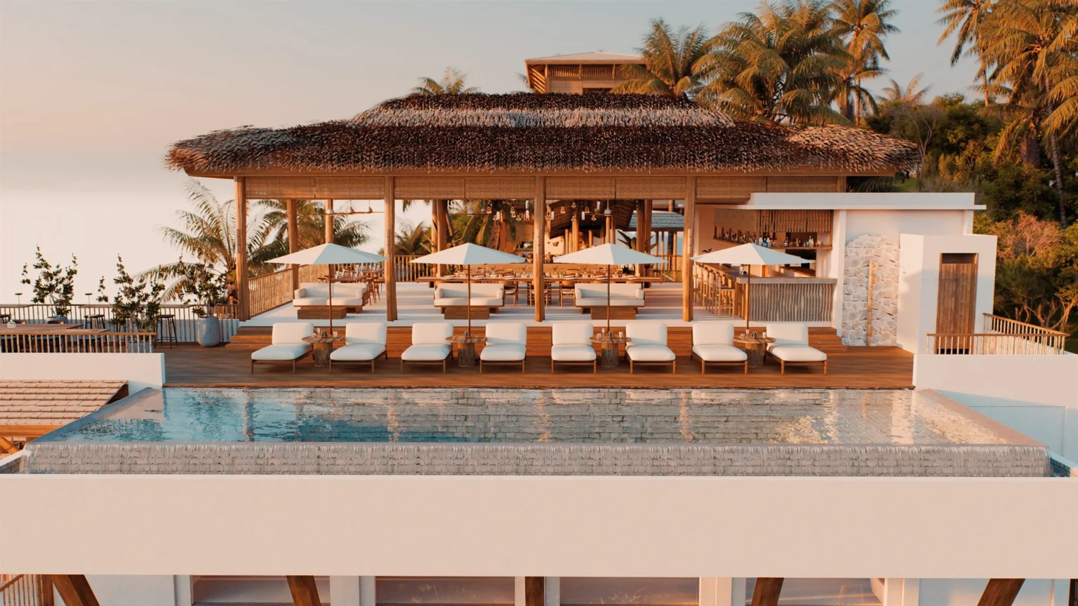 Pool deck with loungers and parasols