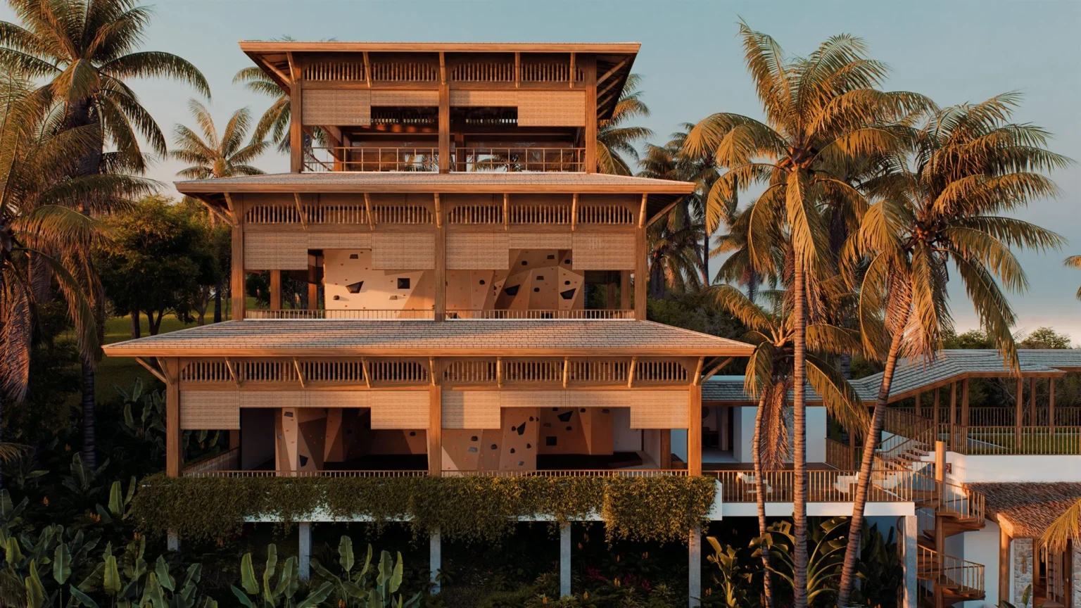 Two-level climbing tower rising above the palms